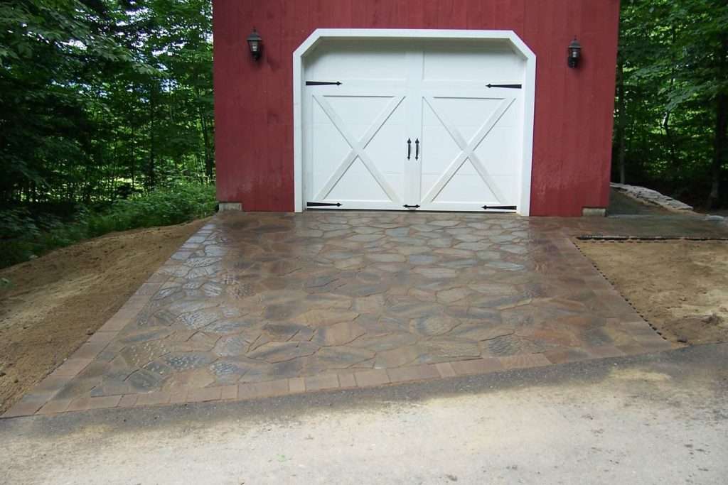 Completed custom paver driveway installation for a New Hampshire home by Landscapes by Tom