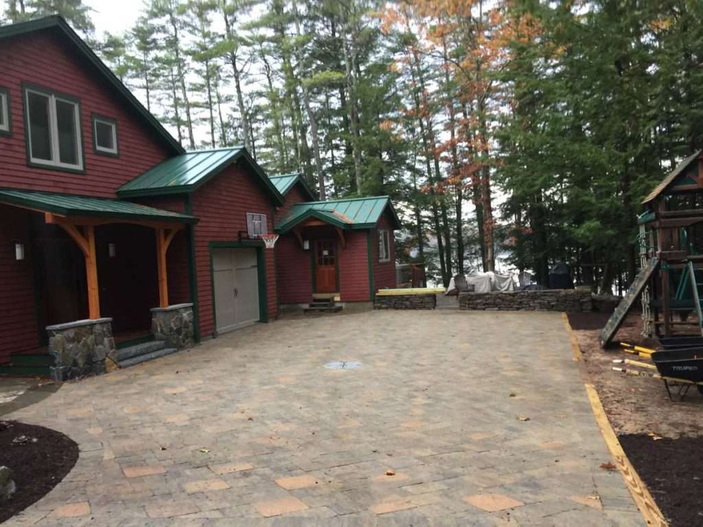 Completed custom paver driveway installation with professional hardscaping by Landscapes by Tom in New Hampshire